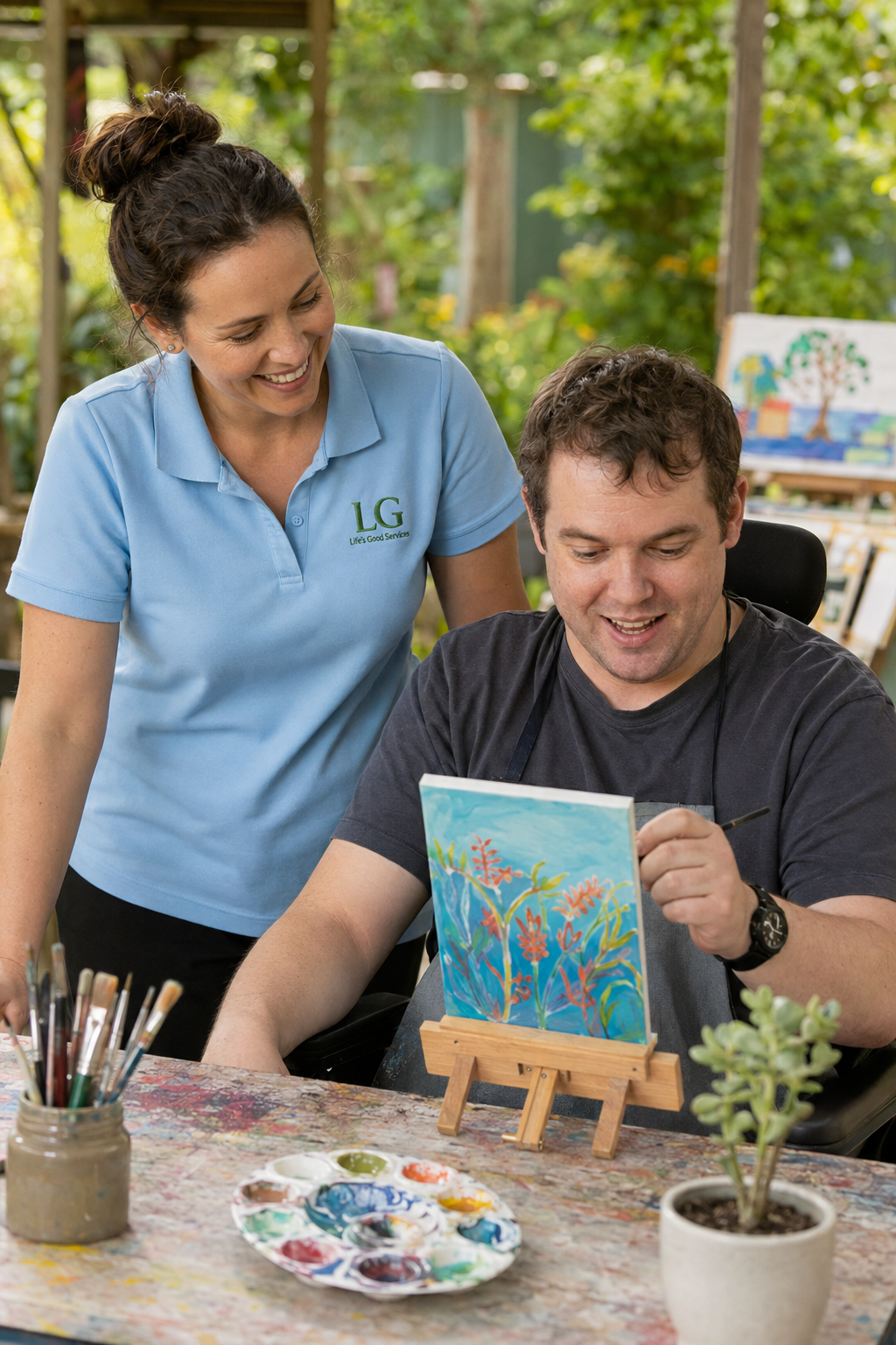 A Life's Good worker supporting a male client with an art activity